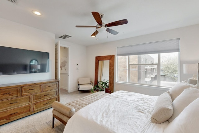 carpeted bedroom with ceiling fan