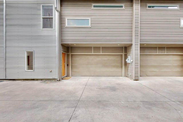 view of side of property with a garage