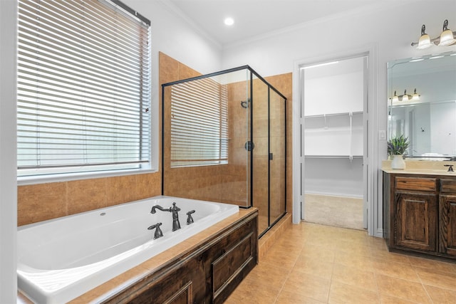 bathroom with shower with separate bathtub, crown molding, vanity, and tile patterned flooring