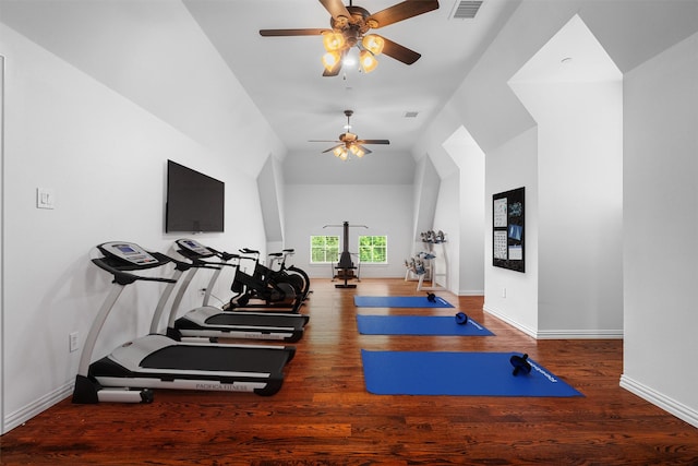 exercise room featuring visible vents, baseboards, ceiling fan, and wood finished floors