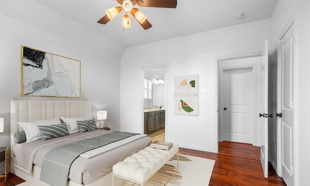 bedroom featuring a ceiling fan, wood finished floors, baseboards, and ensuite bathroom