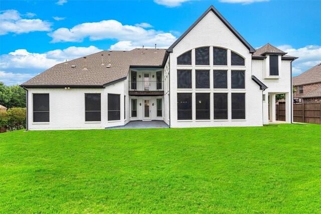 back of house featuring a yard and a patio