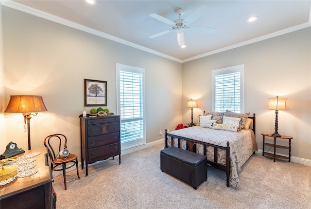 carpeted bedroom with crown molding and ceiling fan