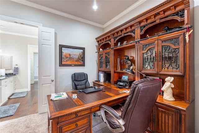 carpeted office featuring ornamental molding