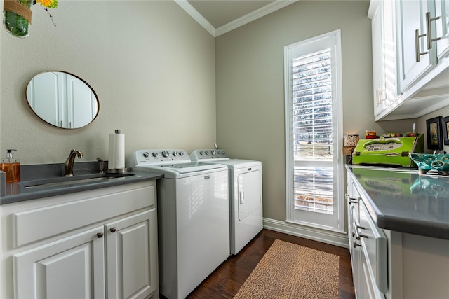 laundry area with separate washer and dryer, sink, cabinets, ornamental molding, and dark wood-type flooring