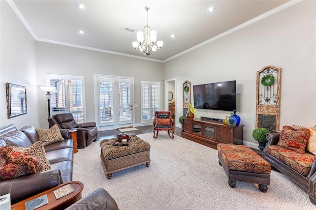 living room with ornamental molding and a chandelier