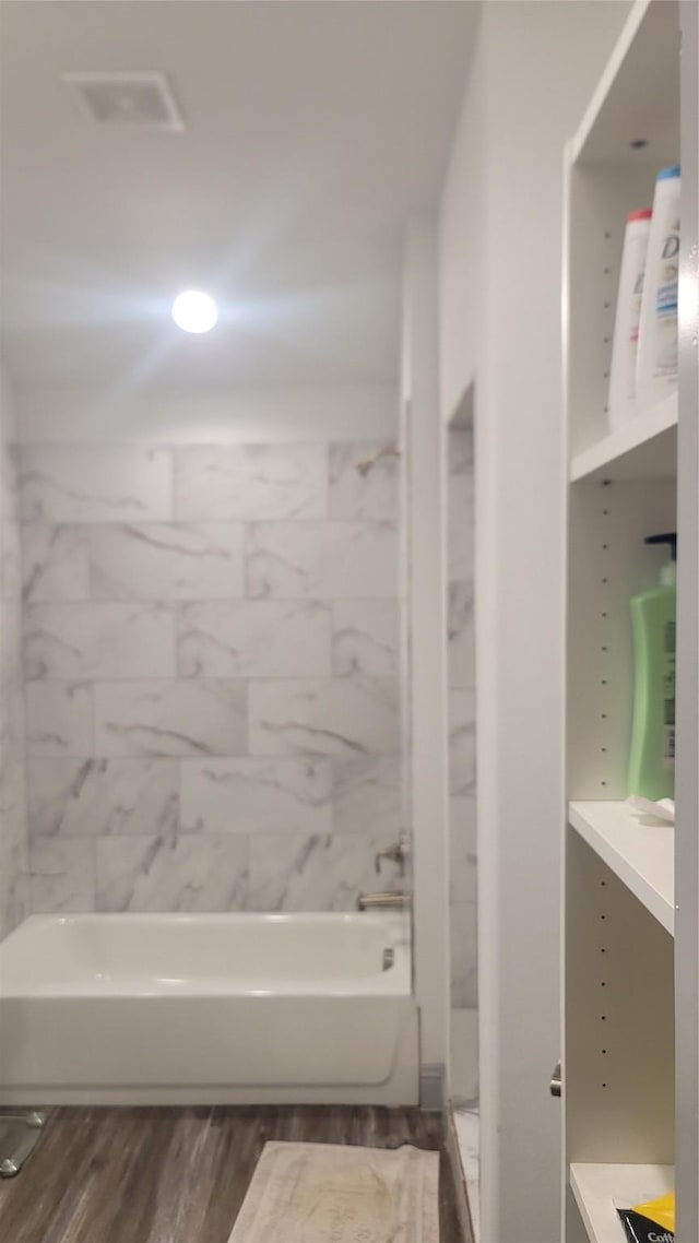 bathroom featuring hardwood / wood-style flooring and vanity