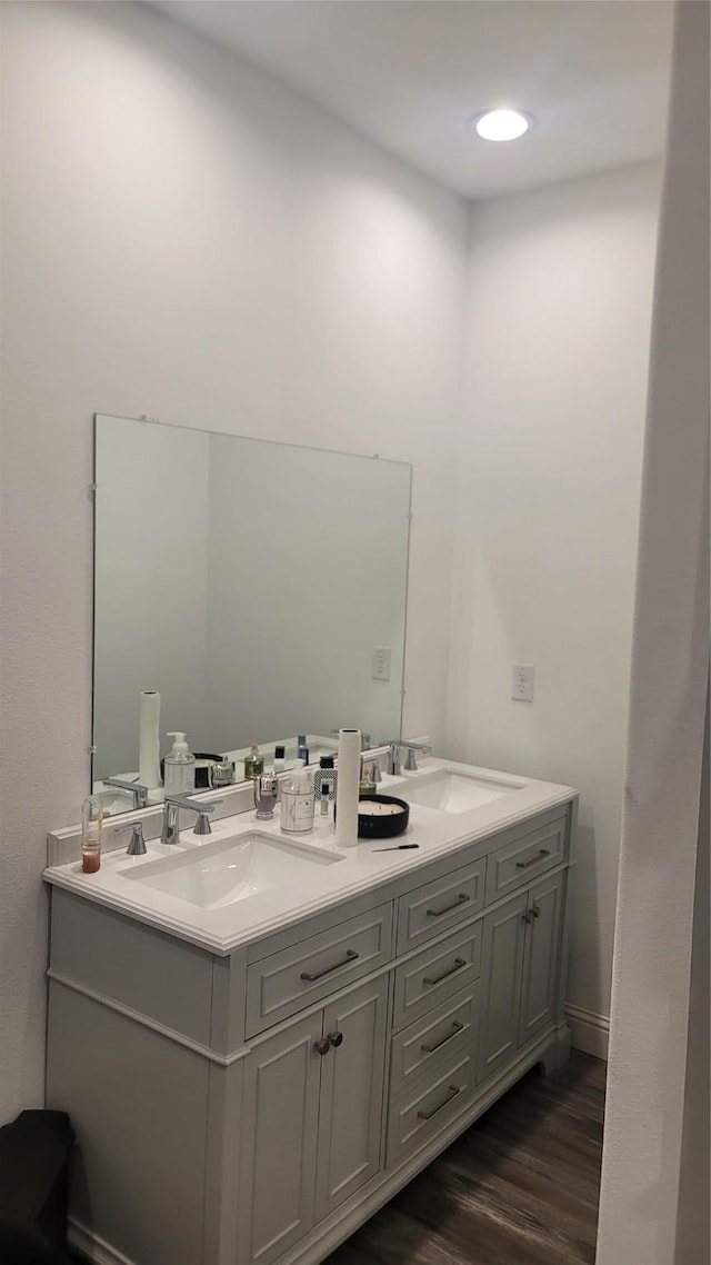 bathroom with hardwood / wood-style flooring and vanity