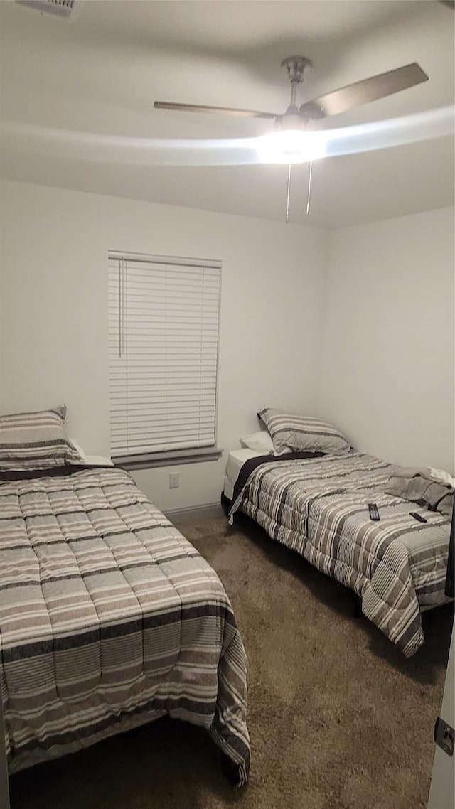 bedroom featuring ceiling fan and carpet floors