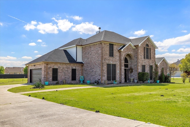 french country style house featuring a garage and a front lawn