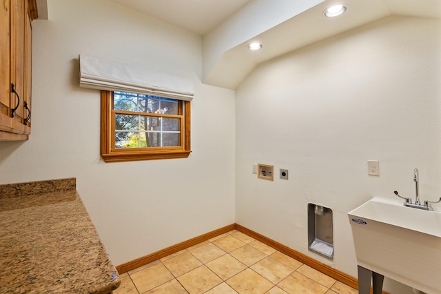 laundry room featuring sink, light tile patterned floors, hookup for a washing machine, and hookup for an electric dryer