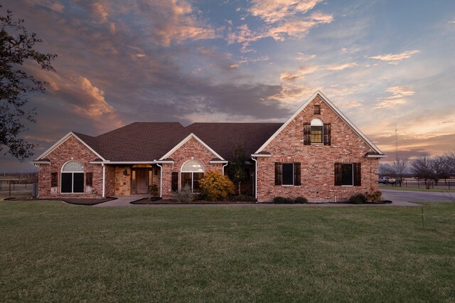 view of front of home featuring a garage and a front yard