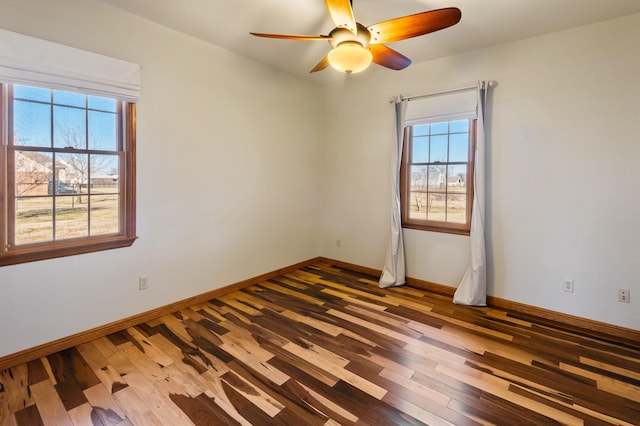 unfurnished room with ceiling fan and wood-type flooring