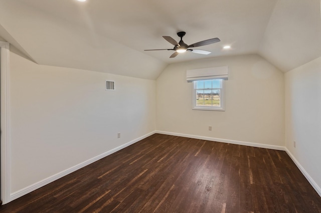 bonus room with dark wood-type flooring, lofted ceiling, and ceiling fan