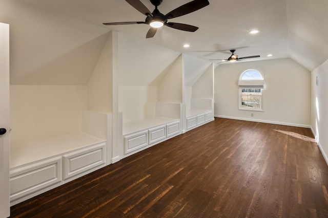 bonus room with lofted ceiling and dark hardwood / wood-style floors