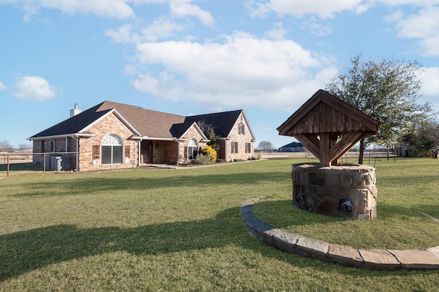 view of property's community featuring a yard