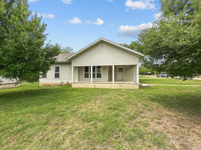 view of front of property with a porch and a front lawn