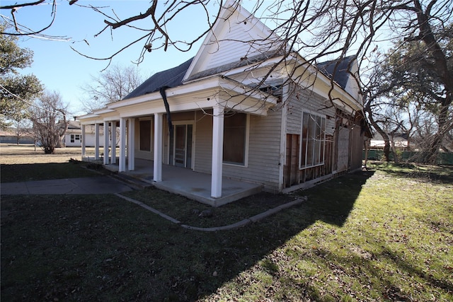 view of home's exterior featuring a patio and a yard