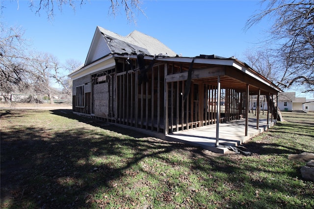 view of property exterior with a lawn