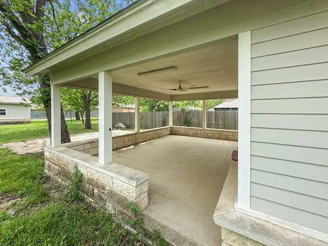 view of patio with fence and ceiling fan
