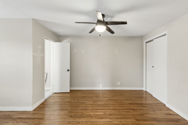 spare room with ceiling fan and hardwood / wood-style floors