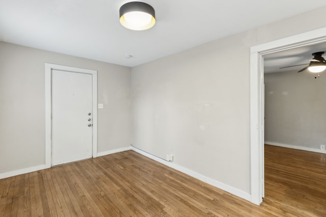 spare room with ceiling fan and hardwood / wood-style floors