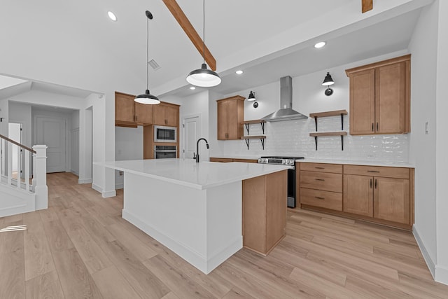 kitchen featuring stainless steel appliances, light wood-style floors, wall chimney range hood, brown cabinets, and open shelves