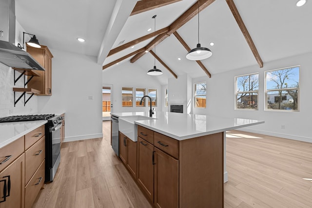 kitchen with beam ceiling, light countertops, gas stove, a sink, and light wood-type flooring