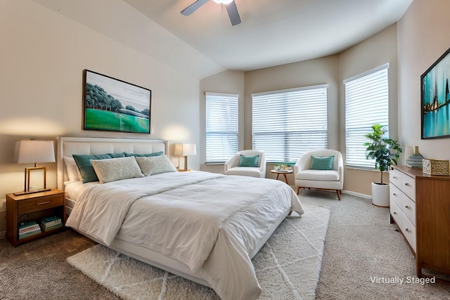 carpeted bedroom featuring lofted ceiling and ceiling fan