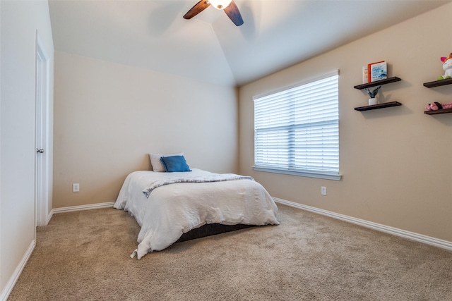 carpeted bedroom with ceiling fan and lofted ceiling