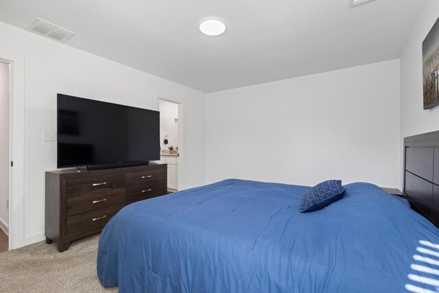 bedroom with light carpet