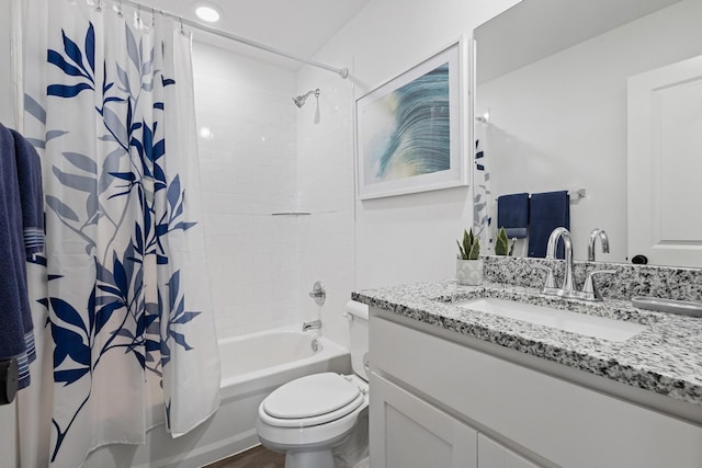 full bathroom featuring vanity, toilet, and shower / bath combo with shower curtain