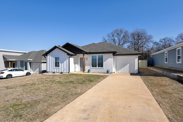 view of front of home featuring a garage and a front lawn