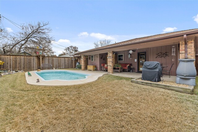 view of pool featuring a yard and a patio area