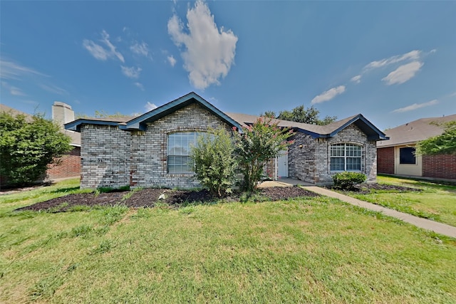 ranch-style home featuring a front lawn