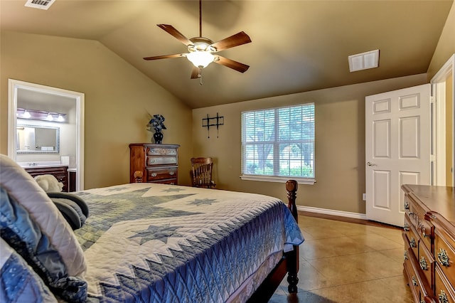 bedroom with ensuite bath, ceiling fan, light tile patterned flooring, and lofted ceiling