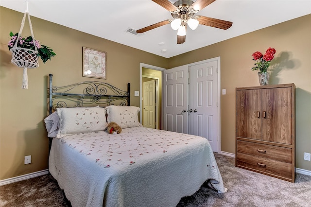 carpeted bedroom with ceiling fan and a closet