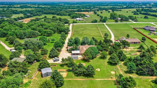 birds eye view of property with a rural view