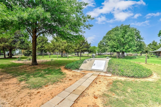 entry to storm shelter featuring a lawn