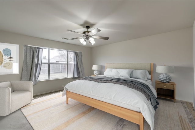 bedroom featuring ceiling fan and carpet