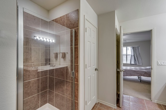 bathroom with walk in shower and tile patterned flooring