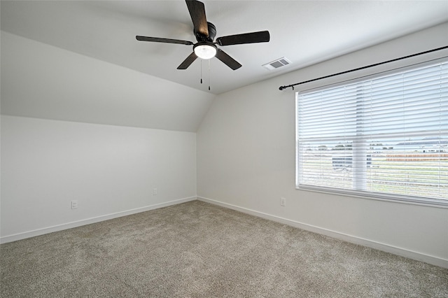 bonus room with ceiling fan, light colored carpet, and vaulted ceiling