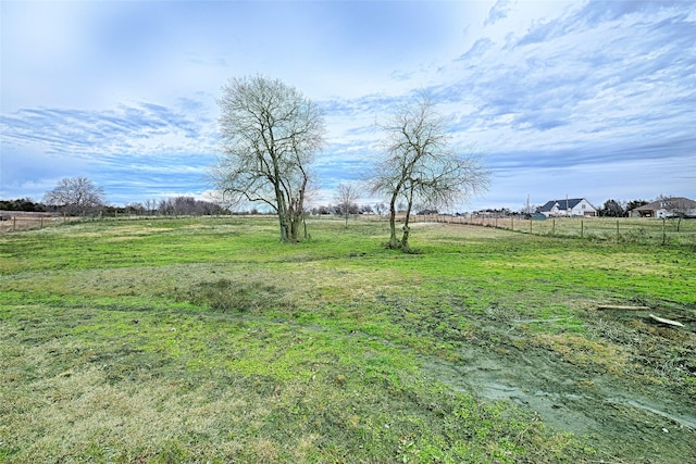 view of yard with a rural view