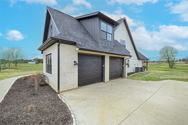 view of home's exterior featuring a lawn and a garage