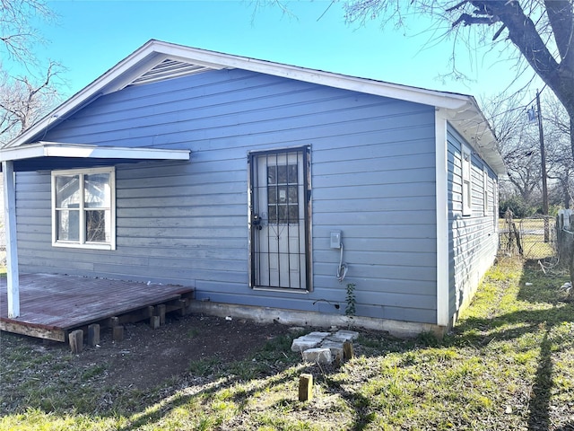 back of property with a wooden deck