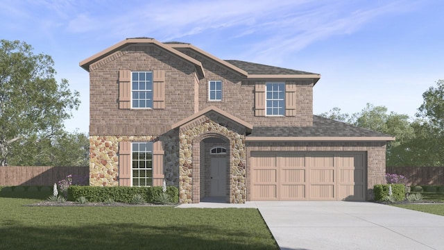 view of front of house with a front yard and a garage