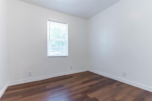 empty room featuring dark hardwood / wood-style floors