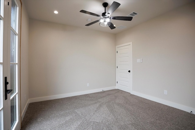 empty room featuring carpet and ceiling fan