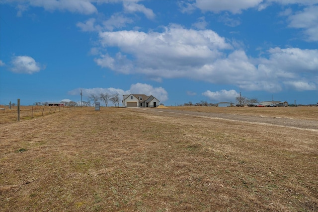 view of yard with a rural view