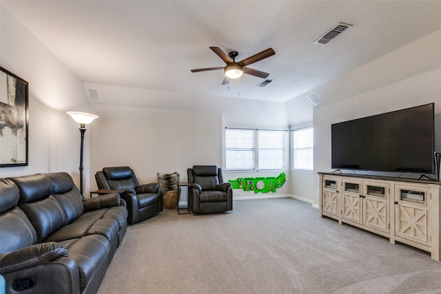 carpeted living room featuring ceiling fan and lofted ceiling